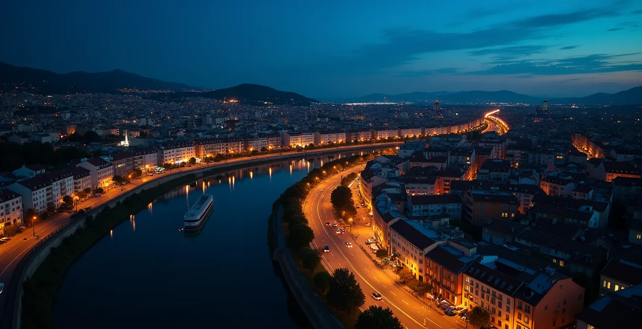 Vue aérienne nocturne d'une ville avec éclairage réduit symbolisant la sobriété énergétique